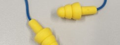 Knurled ear protection with retaining strap