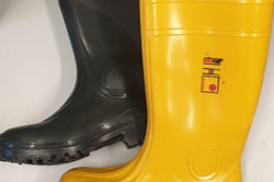 a yellow and a black rubber boot
